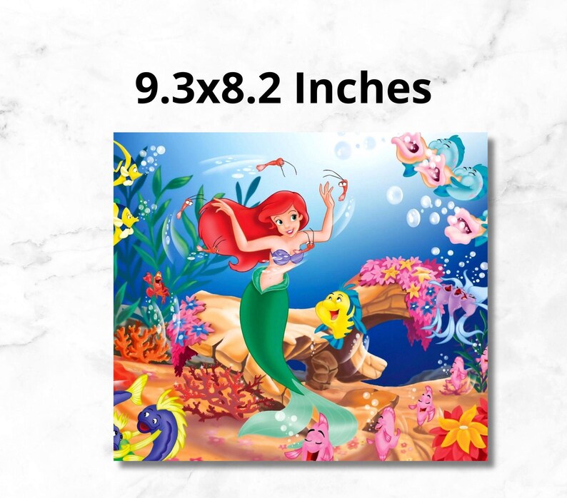 May include: A colorful illustration of Ariel, the Little Mermaid, swimming in the ocean with other sea creatures. The image is 9.3x8.2 inches.