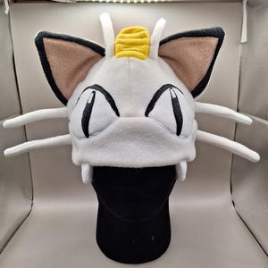 Gorro de lã inspirado no Meowth