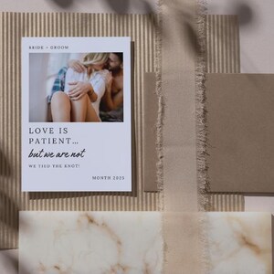 May include: A white card with a photo of a couple embracing. The text on the card reads "Love is patient... but we are not. We tied the knot!" and "Month 2025".