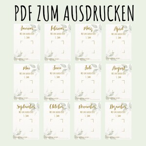 May include: A printable PDF calendar with a pale green background. Each month is displayed on a separate card with gold text and leaf accents. The text at the top reads "PDF ZUM AUSDRUCKEN".
