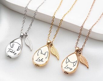 May include: Three teardrop-shaped pet memorial necklaces in silver, gold, and rose gold. Each pendant features a pet portrait and name, with a leaf charm. The necklaces are displayed on a white surface.
