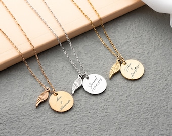 May include: Four gold and silver necklaces with angel wing charms and personalized round pendants. The pendants are engraved with names and dates.