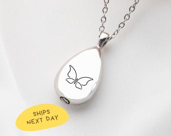 May include: Silver teardrop-shaped pendant necklace with a delicate butterfly design. The pendant has a small opening at the bottom. The necklace is on a silver chain. The image also includes a yellow sticker that says "SHIPS NEXT DAY".
