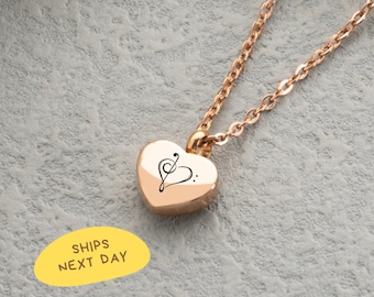 May include: A rose gold heart-shaped pendant necklace with a treble clef design. The pendant hangs from a delicate chain. The image also includes a yellow oval with the text "SHIPS NEXT DAY".
