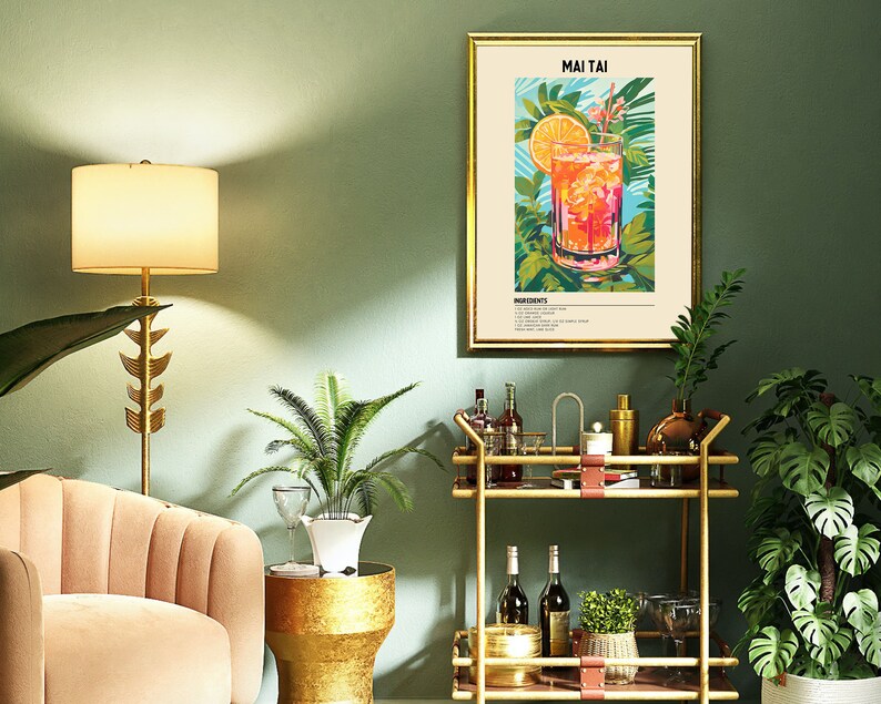 May include: A gold bar cart with two shelves, a glass of Mai Tai, and a framed print with the text "MAI TAI" and a recipe for the cocktail. The cart is decorated with leather straps and has a green plant on the top shelf. The print is set against a green wall.