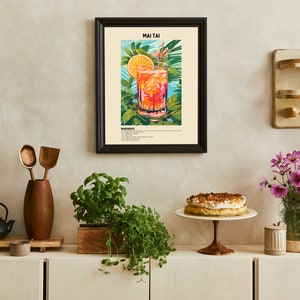 May include: A framed poster with a colorful illustration of a Mai Tai cocktail. The poster has the title "Mai Tai" and a list of ingredients. The poster is hanging on a white wall above a wooden shelf with a cake stand and a vase of flowers.