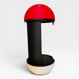 Puede incluir: Un soporte vertical con una c&uacute;pula superior roja, un pilar central negro y una base redondeada blanca. La estructura tiene un dise&ntilde;o abierto con una secci&oacute;n superior roja curva y una base blanca a juego, conectadas por un soporte vertical negro s&oacute;lido.