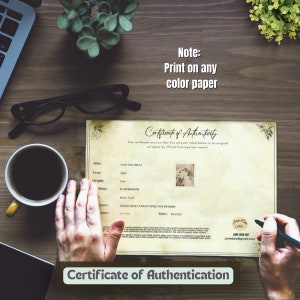 May include: Certificate of Authenticity for a watercolor painting titled "Into the Hills" created in 2023. The certificate is printed on a cream-colored paper with a floral design and includes the artist's name and contact information. Note: Print on any color paper.