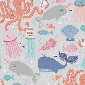 May include: A repeating pattern on a light gray background featuring coral octopuses, gray narwhals, blue whales, pink and teal jellyfish, various seashells, and small fish. The design includes white circular bubbles scattered throughout the scene.