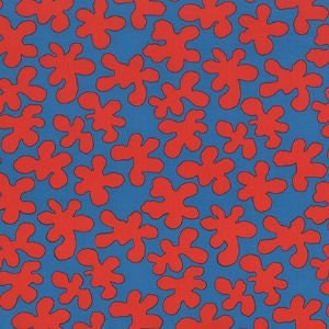 May include: A repeating pattern of red abstract shapes on a blue background. The shapes are irregular and resemble stylised flowers or leaves.