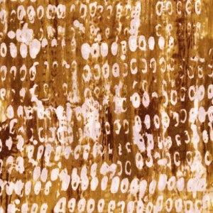 May include: Abstract brown and white patterned fabric with a textured surface.