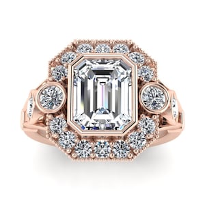 May include: A rose gold engagement ring with a large emerald cut diamond center stone. The center stone is surrounded by a halo of smaller diamonds. There are two additional round diamonds on the band.
