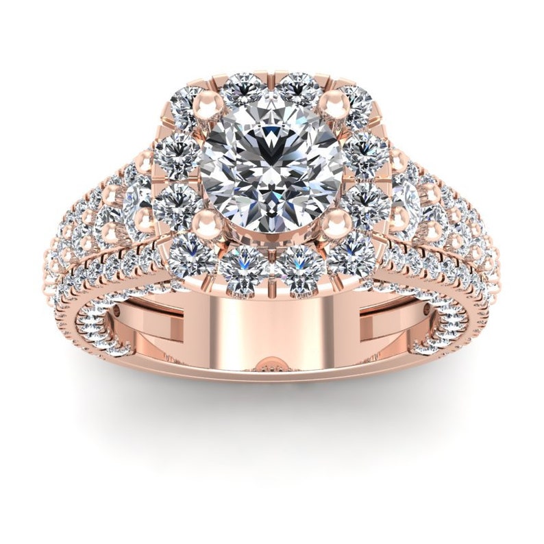 May include: A rose gold engagement ring with a large, round center diamond surrounded by a halo of smaller diamonds. The band is also set with smaller diamonds.