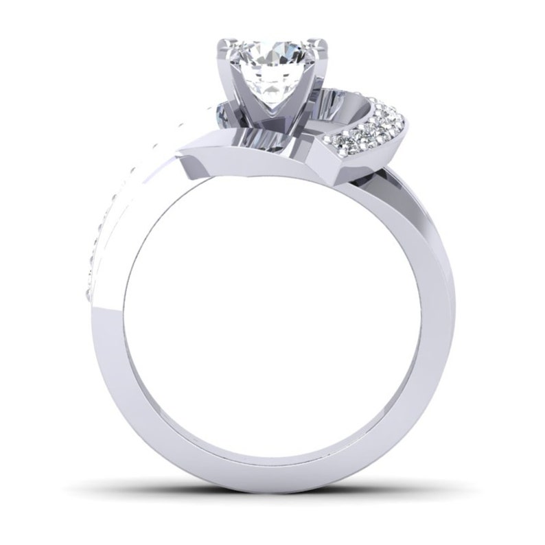 May include: A silver engagement ring with a large, clear, round center stone and smaller, clear stones set in a twisted band.