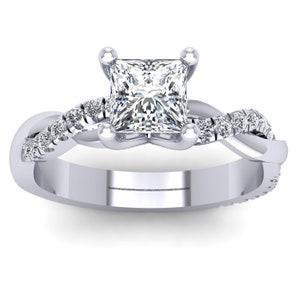 May include: A silver engagement ring featuring a square-cut diamond and a twisted band adorned with smaller diamonds.