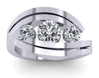 May include: A silver ring with three round diamonds set in a wave-like design.