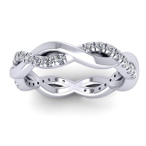 May include: A silver infinity band ring with a row of small diamonds set in the band.