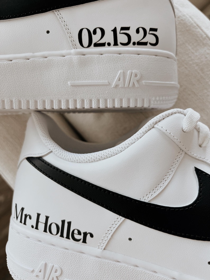 May include: White sneakers with black accents. The shoes feature the text "02.15.25" on the heel and "Mr. Holler" on the side. The word "AIR" is visible on the sole.