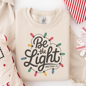 Be The Light Sweatshirt, Religious Christmas Sweatshirt, Christian Holiday Sweater, Faith Based Gift, Christmas Gifted, Festive Apparel