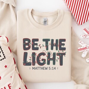 Be The Light Sweatshirt, Religious Christmas Sweatshirt, Christian Holiday Sweater, Faith Based Gift, Christmas Gifted, Festive Apparel