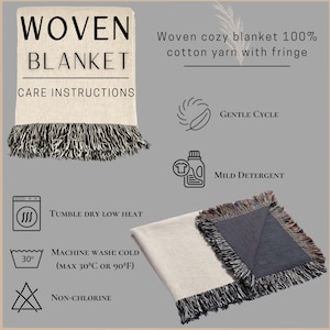 May include: Woven blanket with fringe. The blanket is beige with black fringe and the text "WOVEN BLANKET CARE INSTRUCTIONS". The image also shows care instructions: gentle cycle, mild detergent, tumble dry low heat, machine wash cold, and non-chlorine.