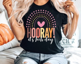 May include: Black t-shirt with a rainbow of hearts and the text "HOORAY! it's Tech day"