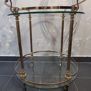 Vintage serving trolley made of glass and brass