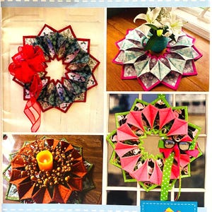 May include: A brochure showcasing a "Fold'n Stitch Wreath" project. The brochure features four colorful examples of the finished wreath, with a finished size of 21 inches in diameter. The text includes the skill level as "Advanced Beginner".