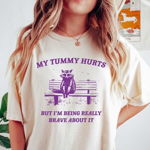 My Tummy Hurts Raccoon T-Shirt: Meme Unisex Tee