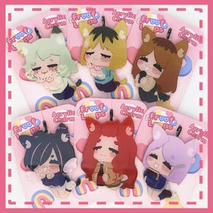 May include: Six acrylic charms featuring illustrated characters with animal ears, each attached to a pink backing card labeled "Froof Loops Acrylic Charm." The characters have varied hair colors including mint, blonde, brown, black, red, and lavender.
