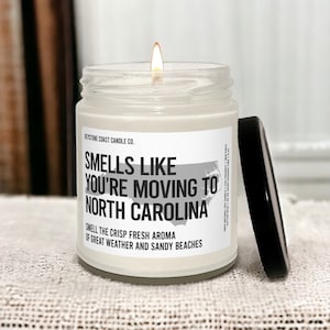 Smells like you're moving to north carolina scented soy candle, 9oz, white label