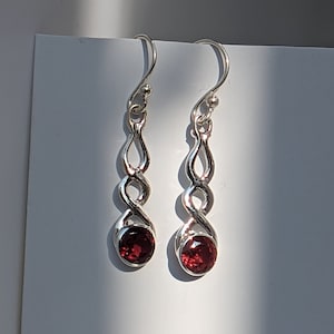 Garnet and sterling silver dangle earrings.