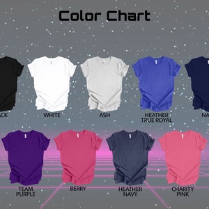 May include: Color chart showing different t-shirt colors, including black, white, ash, heather true royal, navy, team purple, berry, heather navy, and charity pink.