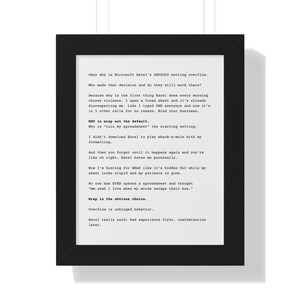 May include: A framed print with black trim features a white background with black text. The text discusses frustrations with Microsoft Excel's default settings, including overflow issues and the lack of text wrapping. The print is a humorous commentary on spreadsheet software.