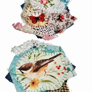 May include: Two fabric collages featuring layered textile scraps. The top piece includes a red butterfly, floral patterns, and pink crochet trim. The bottom piece features a bird illustration on a light blue background with white lace trim.