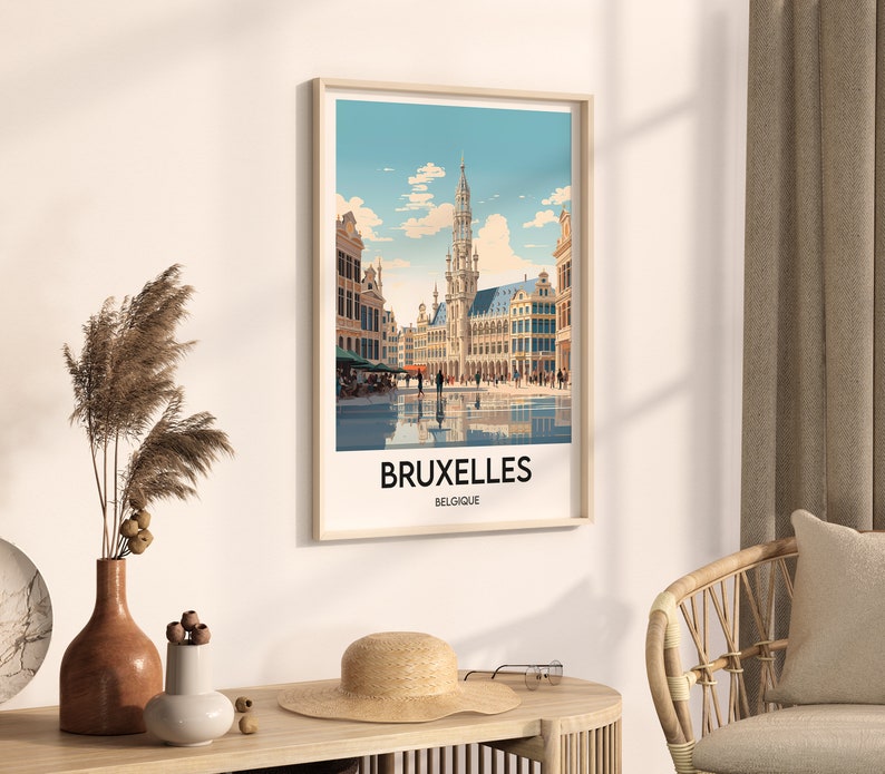 May include: A vintage-style travel poster featuring a colorful illustration of the Grand Place in Brussels, Belgium. The poster has a blue background with white clouds and the text "BRUXELLES BELGIQUE".