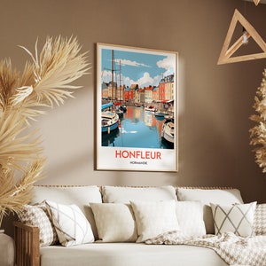 May include: A vintage-style poster with a colourful illustration of a harbour scene in Honfleur, Normandy, France. The poster features a blue sky with white clouds, a harbour with boats, and colourful buildings along the waterfront. The text "Honfleur, Normandie" is printed in red at the bottom of the poster.