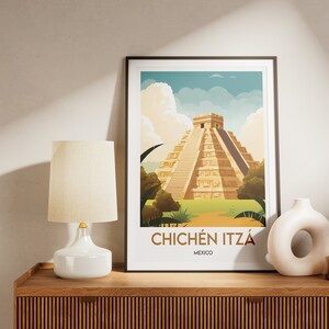 May include: A framed poster with a colorful illustration of the Chichen Itza pyramid in Mexico. The poster has a white background with the text "Chichen Itza" and "Mexico" printed below the illustration.