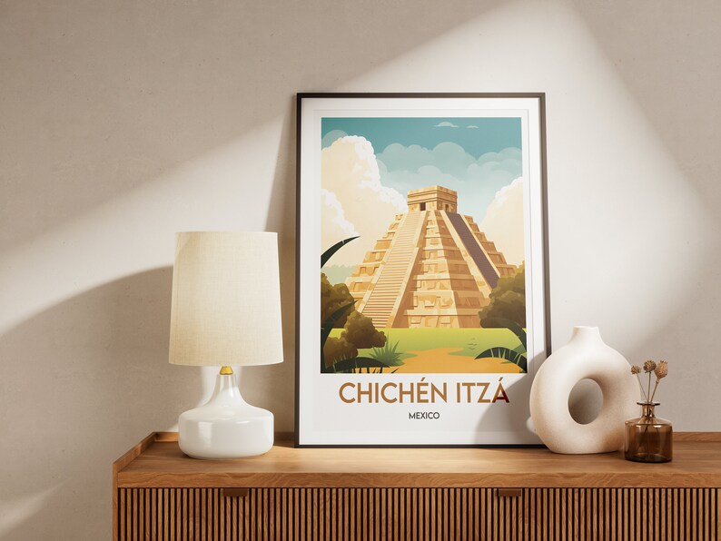 May include: A framed poster with a colorful illustration of the Chichen Itza pyramid in Mexico. The poster has a white background with the text "Chichen Itza" and "Mexico" printed below the illustration.