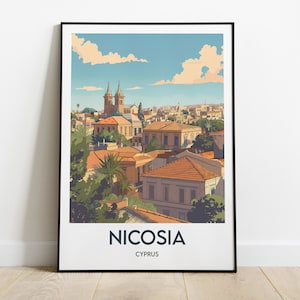 May include: A framed art print featuring a stylized illustration of Nicosia, Cyprus. The artwork depicts a cityscape with buildings, trees, and a blue sky with clouds. The print includes the city name and country.