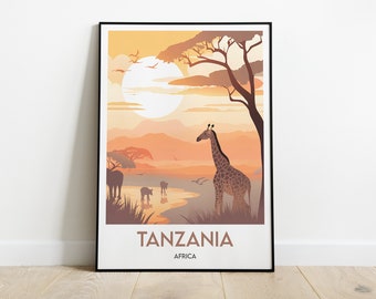 Puede incluir: Un póster enmarcado con un paisaje de puesta de sol con una jirafa, otros animales y un gran árbol. El póster tiene el texto "TANZANIA" y "AFRICA" en la parte inferior.