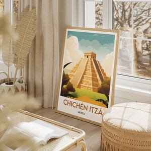 May include: A framed poster with a colorful illustration of the Chichen Itza pyramid in Mexico. The poster has a white background with the text "Chich&eacute;n Itz&aacute;" and "Mexico" in brown lettering.
