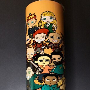 May include: A stainless steel tumbler with a colorful cartoon design featuring a group of characters. The characters are wearing different outfits and have various expressions. The background is a light orange color.