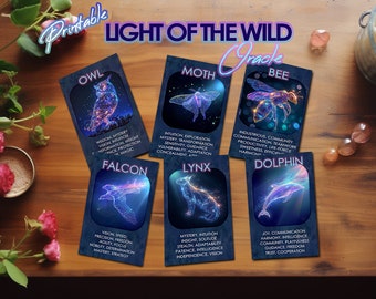 May include: Printable oracle cards with colorful illustrations of animals, including an owl, moth, bee, falcon, lynx, and dolphin. Each card features the animal's name and a list of keywords associated with it.