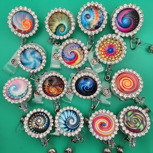 Swirl and Circular Patterns Framed by Rhinestones 2 clip badge retractable reel