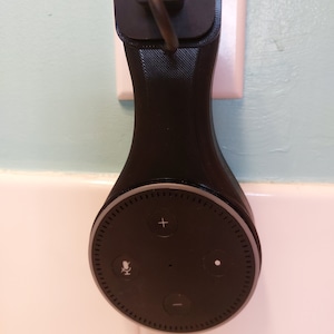 Wall mount for second generation echo dot ( Alexa ) decide. Hides cord and keeps it off the table or counter. Looks sleek and  contained