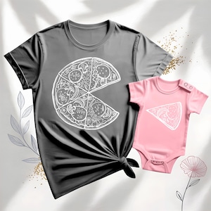 May include: A gray t-shirt and a pink baby onesie. Both garments feature a white pizza slice design. The t-shirt has a complete pizza graphic with a missing slice, while the onesie has a single slice.