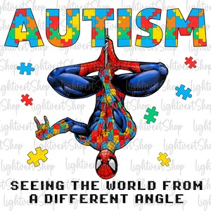 May include: A graphic design featuring a red and blue superhero figure hanging upside down. The superhero's suit is made up of puzzle pieces in shades of blue, red, yellow, and green. The word "AUTISM" is written in large letters above the superhero, also made up of puzzle pieces. The text "SEEING THE WORLD FROM A DIFFERENT ANGLE" is written below the superhero.