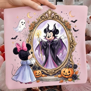 May include: A light pink fabric square featuring a cartoon mouse in a light blue dress looking into an ornate gold mirror. Inside the mirror, a mouse dressed as a dark sorcerer holds a golden staff. The design includes a ghost, bats, and pumpkins.