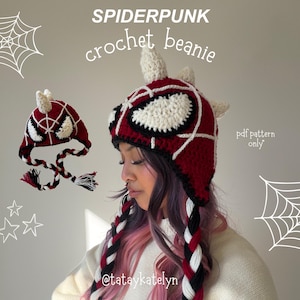 May include: A red, white, and black crochet beanie featuring a spiderweb pattern, large white eye patches, and three spikes on top. The beanie has long braided earflaps in red, white, and black. Text reads SPIDERPUNK crochet beanie and pdf pattern only.